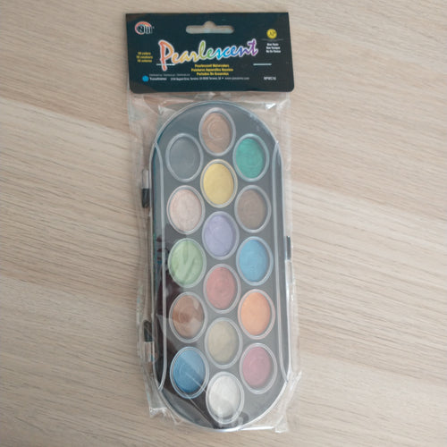 Image of water color palette in packaging.  Colors included are black, hazel, teal, yellow, light pink, brown, purple, sage green, orange, rosegold, brass, blue, gold, light blue, magneta, and white (all pearlescent). 