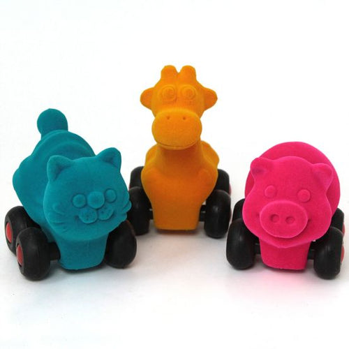Teal cat, yellow giraffe, and pink pig variants of the fuzzy animals.  All on wheels!