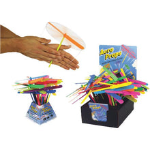Load image into Gallery viewer, A hand twirling an Aero Prop flyer clockwise before release, above a slew of the Aero Props flyers in two different containers.
