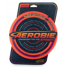 Load image into Gallery viewer, Aerobie 10&quot; ring in packaging.  An orange disc with black cardboard backing. 
