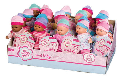 Dolls all standing within their box, almost comically looking in the same direction.  There are darker and lighter skintones, which all wear a variety of patterned pajamas and hats.  All doll are hairless and without eyebrows.  