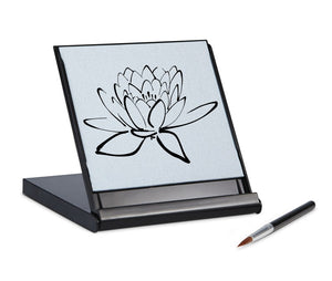 image of mini Buddha board with brush besides it. 